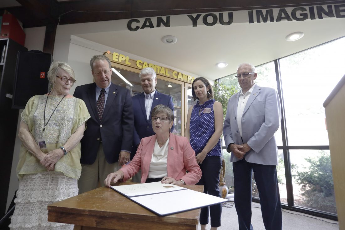 At bill signing in Eudora, Gov. Kelly goes off script to praise immense